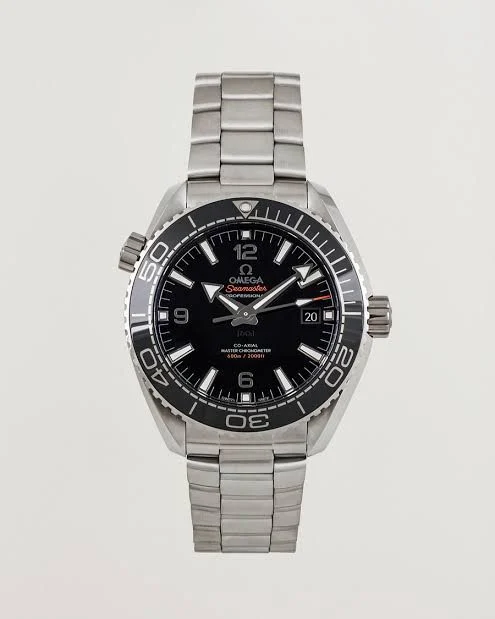 810ed39a-70d2-4976-a3c3-beb8b23f4681 ساعه من007 OMEGA بلون مينا اسود وسير فضي من الستانليس ستيل - Image 1